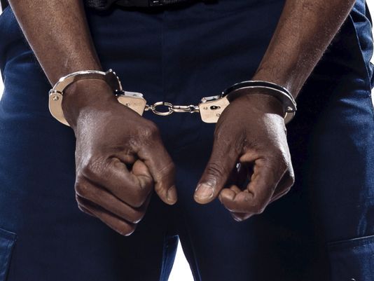 Arrested suspect on handcuffs